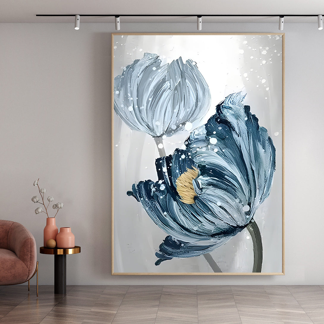 A large vertical painting of 2 blue flowers in a white or grey background. 