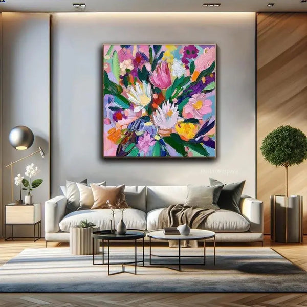 A large square textured painting of flowers in pink, white, orange and purple with green leaves, against the blue backdrop.