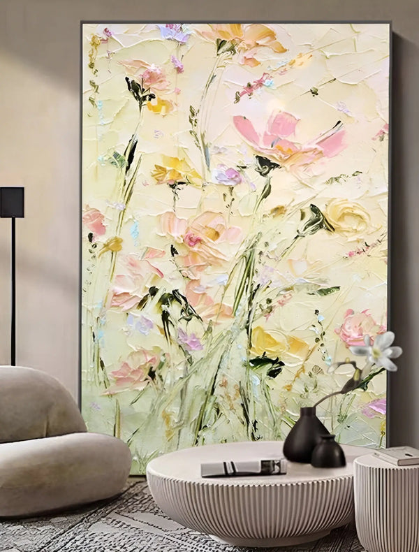 A large vertical textured painting of pink and yellow abstract flowers with green stems and leaves against a yellow backdrop. 
