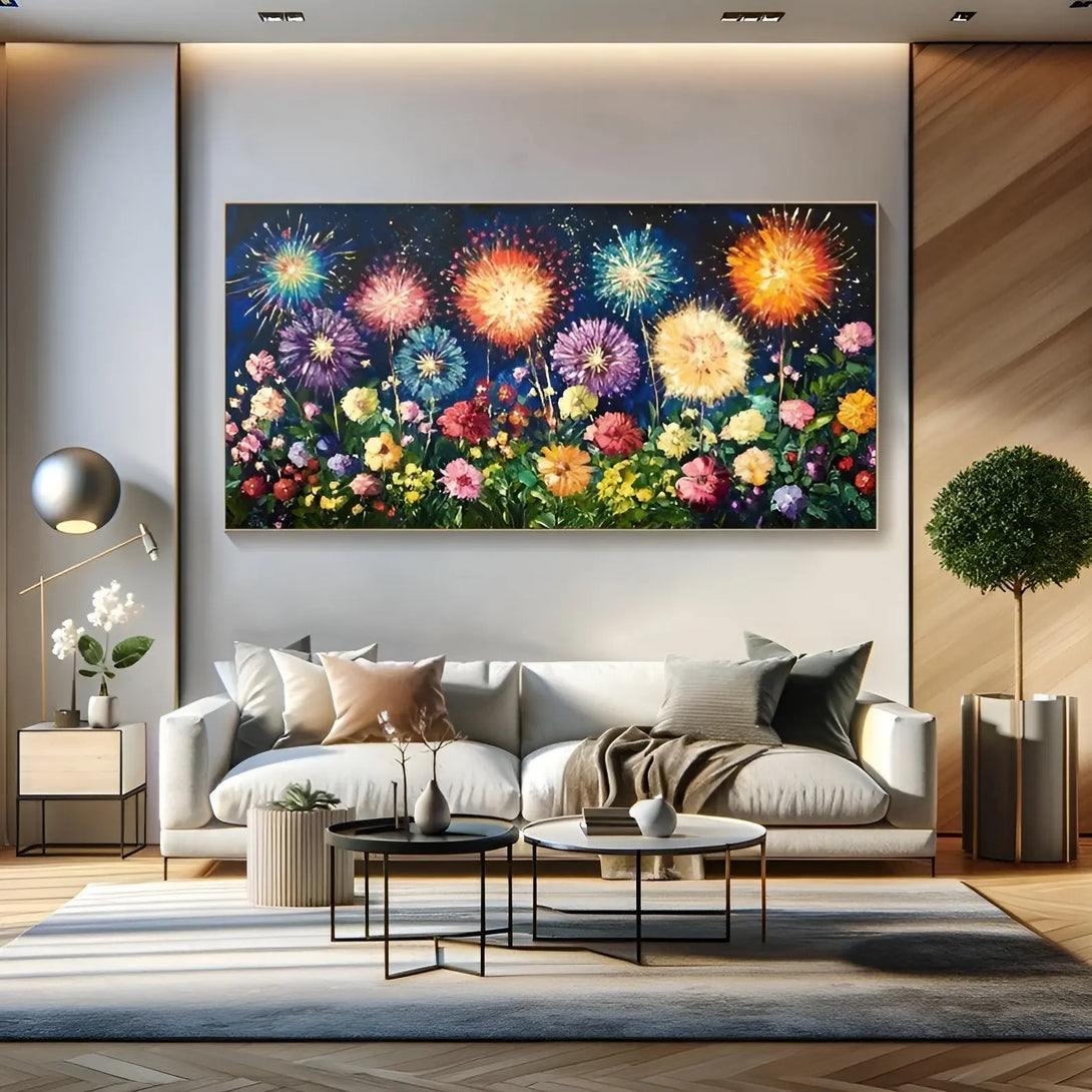 A large horizontal textured wall art of colorful blooms in pink, yellow, orange, red, beneath the blue, purple and orange fireworks in the night sky. 
