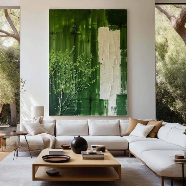 A large vertical textured wall art in green and white, with a small green tree at the bottom left corner of the canvas.