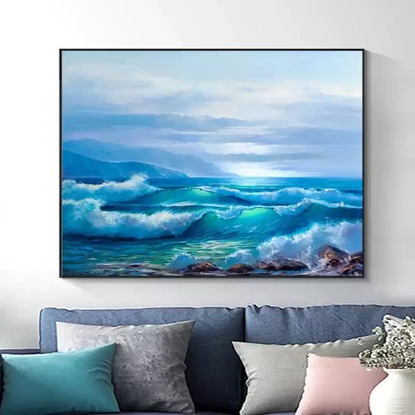 A large horizontal wall art of the blue sea waves rushing towards the shore.