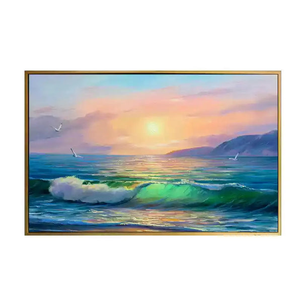 A large horizontal wall art of the blue sea waves bathed in the orange sunlit under the pink sky.
