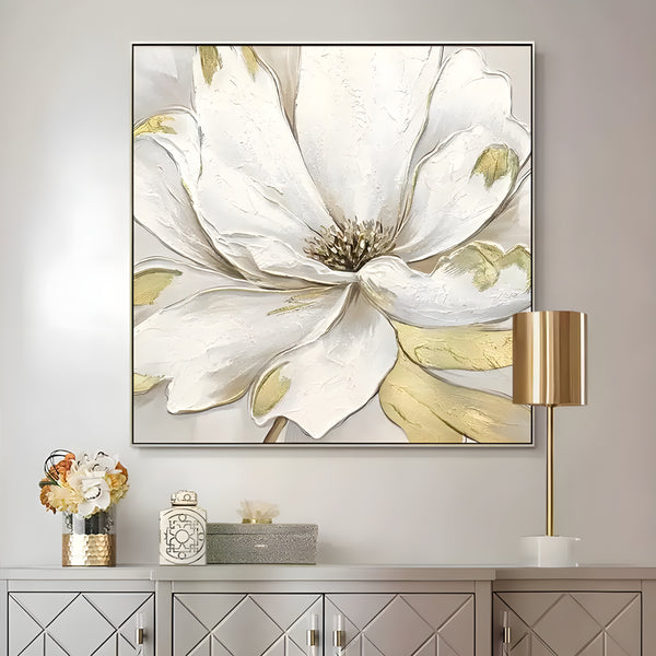 A square abstract painting featuring a large white flower with shades of gold