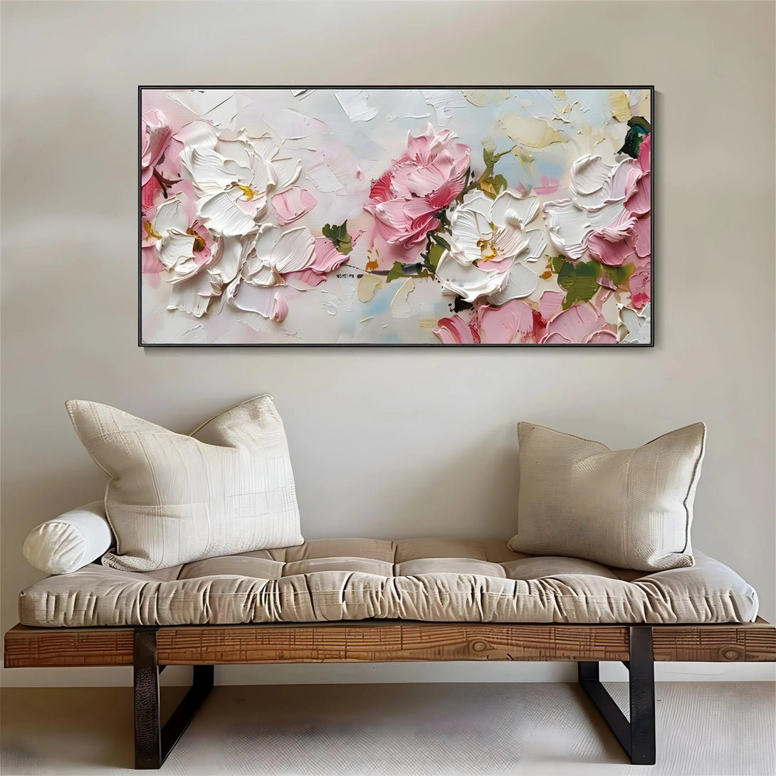 A horizontal abstract painting of multiple flowers in pink and white. 