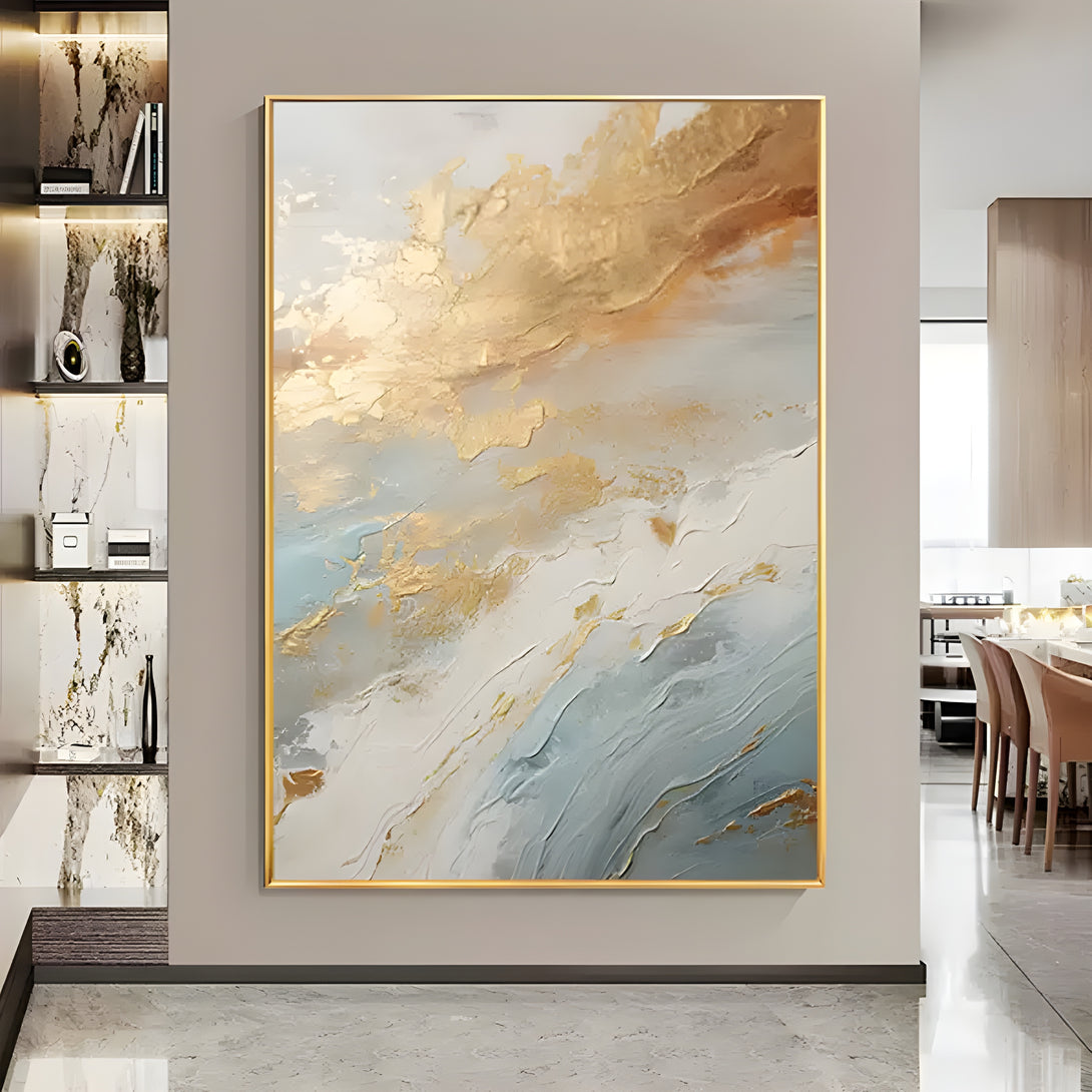 A large abstract colorful painting with gold, blue, grey and white shades.