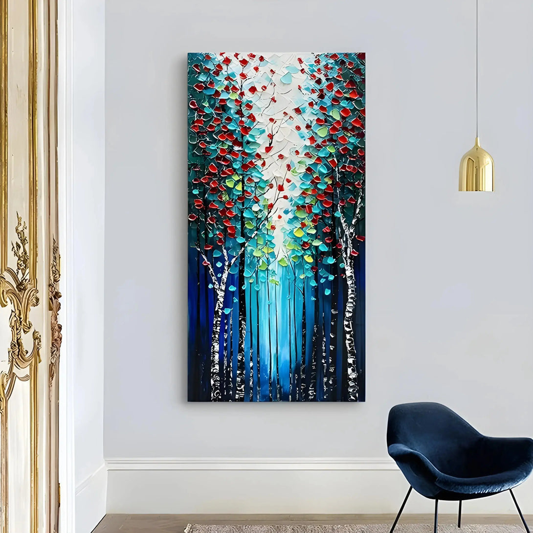 A large vertical painting of 2 lines of tall trees with red, green and blue leaves on top
