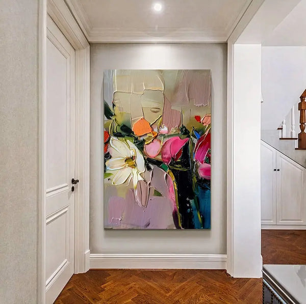 A large pink textured painting of a branch of flowers in white and pink against a pink backdrop.