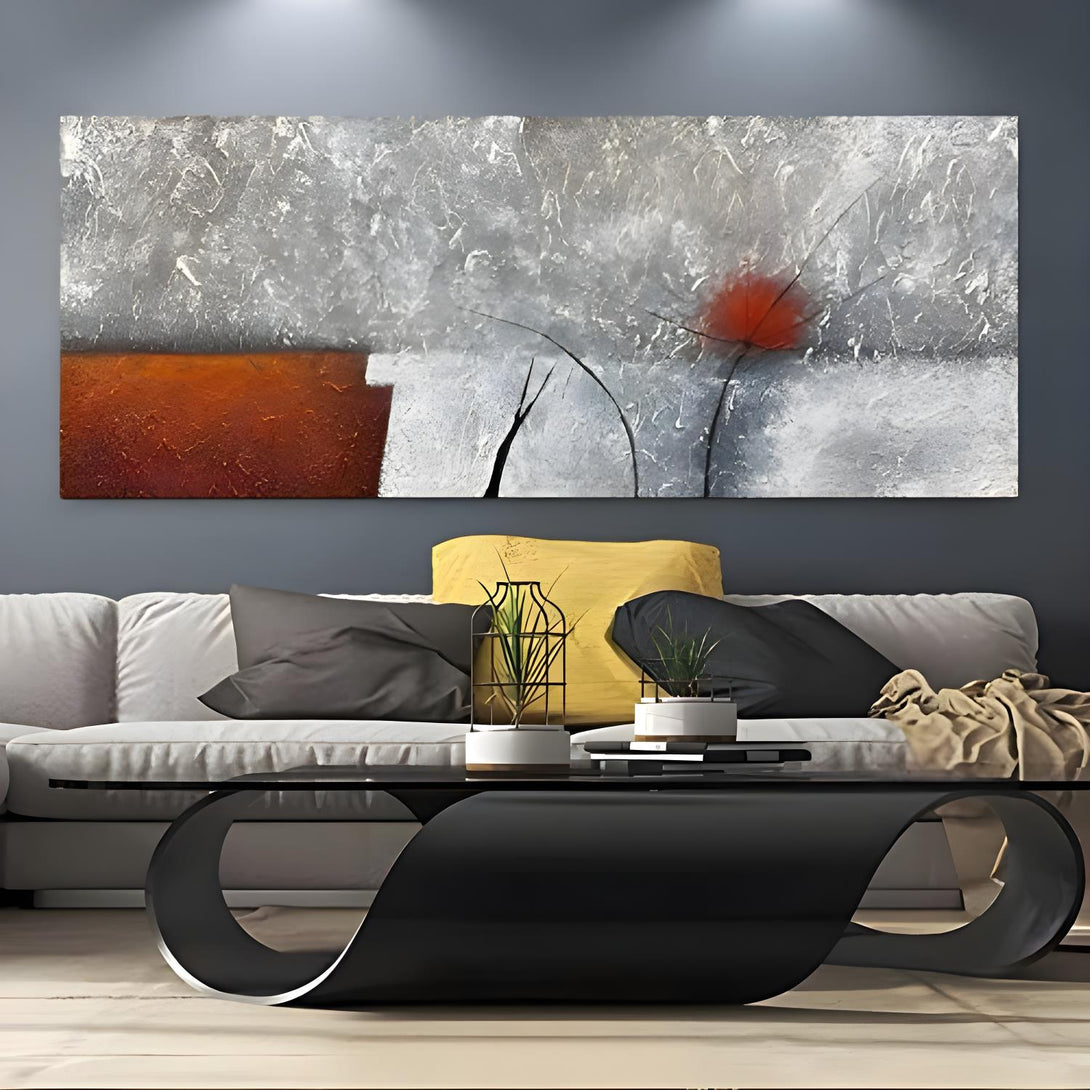 A large painting in grey and orange textures with a modern look