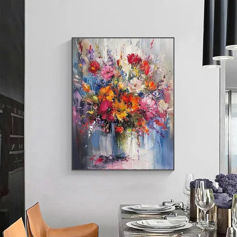 A large textured floral painting of orange, yellow, pink and red flowers in a vase, against a blue, white and pink backdrop. 