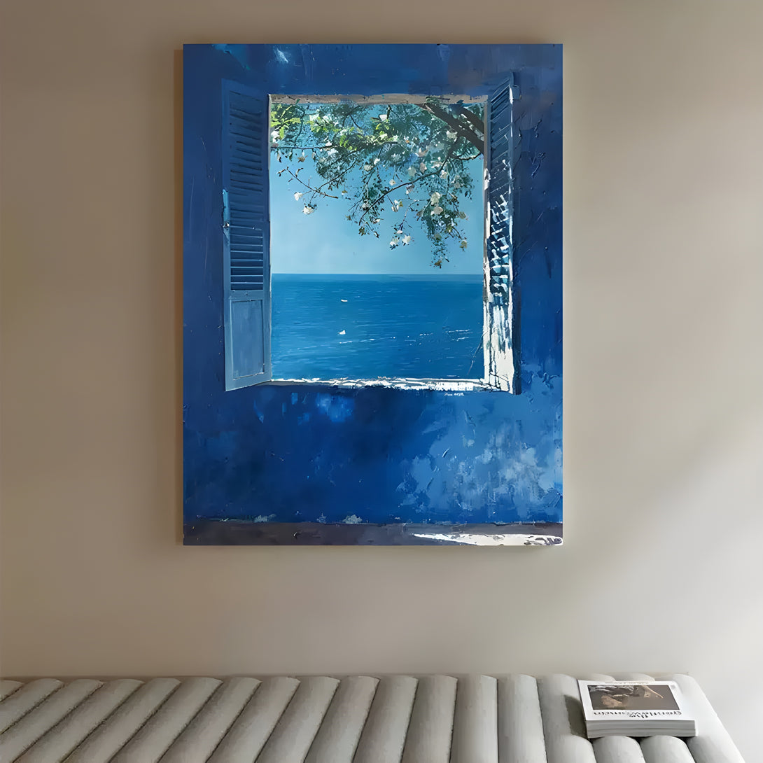A large blue textured painting of a blue wall featuring an open window,  framing a view of the tranquil blue sea beneath a lush green tree and delicate white blossoms.
