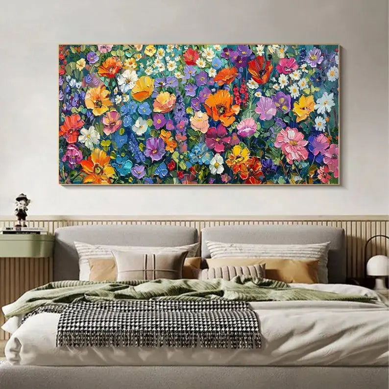 A large horizontal painting with a variety of flowers in red, orange, blue, white, pink, yellow, etc, against a red backdrop