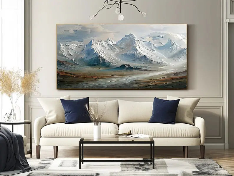  A large horizontal textured painting featuring rolling snowy mountain ranges in light blue under the grey sky
