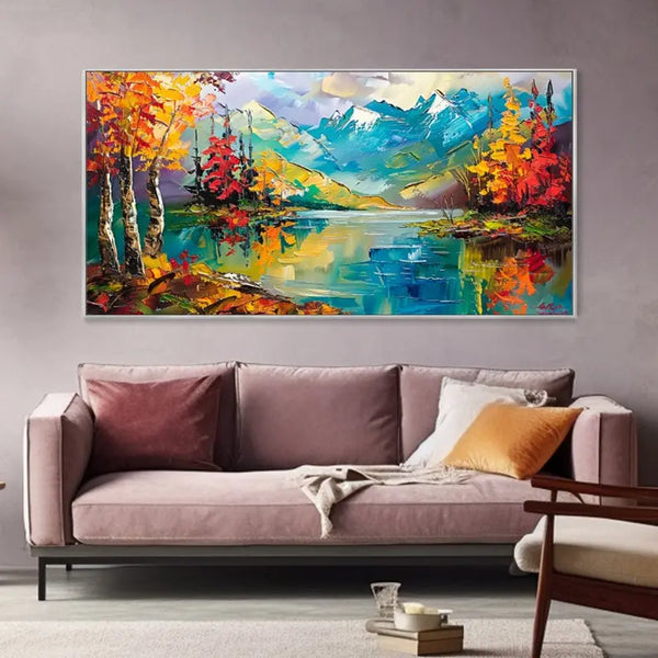 A large horizontal textured painting of a lake landscape where a blue tranquil lake is surrounded by fields of yellow trees and blue icy mountains. 
