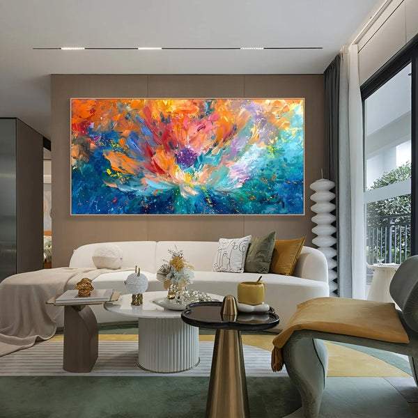 A large horizontal textured wall art of a floral cascade in orange and purple, against a blue backdrop
