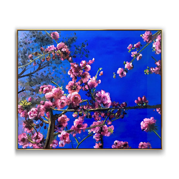 A large horizontal textured wall art of cherry blossoms on the branches against the blue sky. 