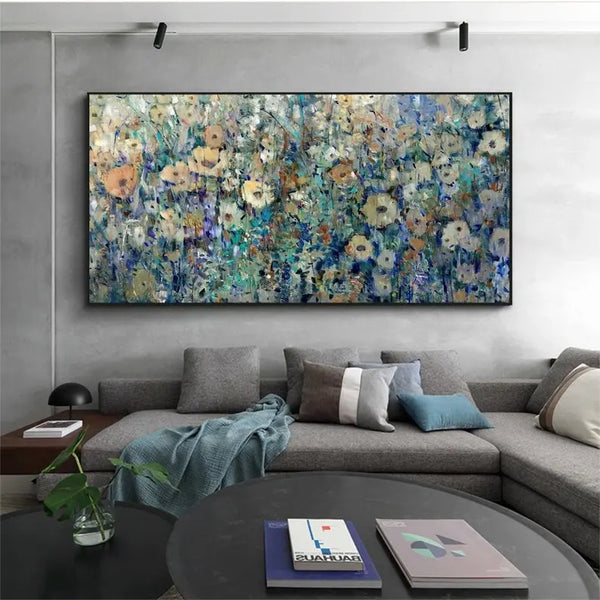 A large horizontal textured wall wart of flowers in beige against a background of blue and light green. 

