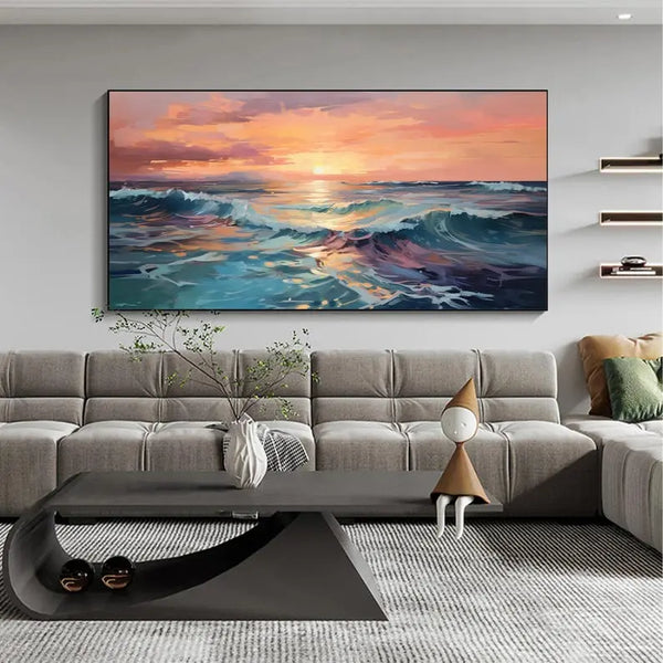 A large horizontal wall art of the blue sea water under the sun-lit orange sky. 
