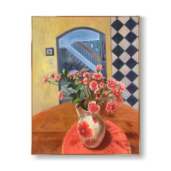 A large vertical abstract painting with a pot of flowers on the brown table, with the door open, reflecting the stairs outside. 