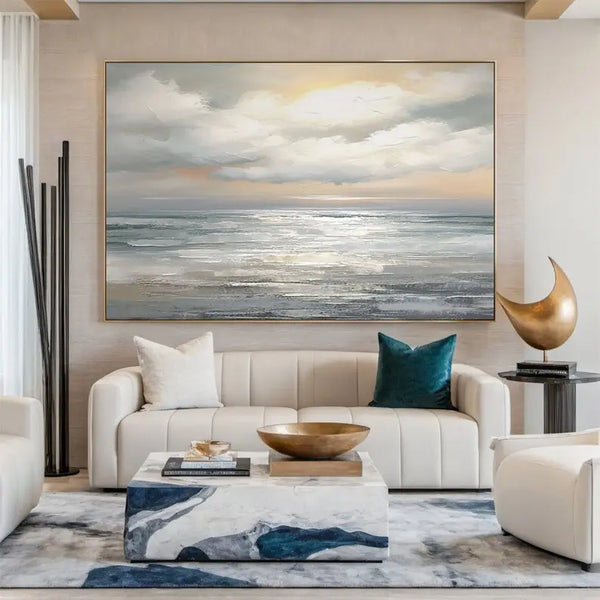 A large, vertical abstract seascape painting in grey tones with textured ocean waves under a calm, cloud-filled evening sky.