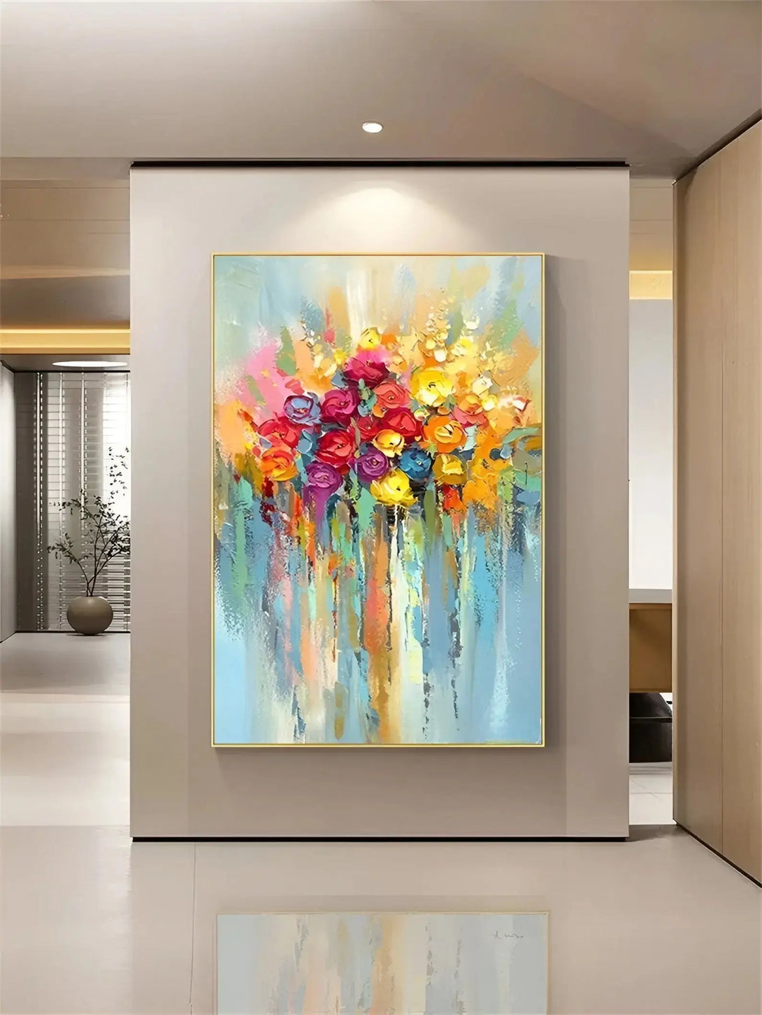 A large vertical acrylic painting of flowers in yellow, orange, red, purple and blue, against a blue backdrop. 
