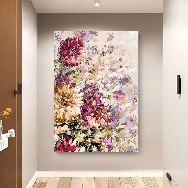 A large vertical flower painting of purple, red, orange and white flowers against a pink and white backdrop. 