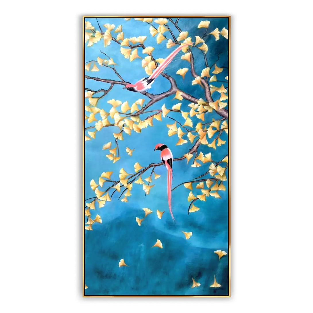 A large vertical hyperrealism art of two pink and black long-tail birds on the yellow ginkgo trees against a blue backdrop. 