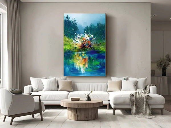  A large vertical painting featuring the blue river, framed by hilly slopes with colorful flowers reflected in the water. Behind are misty mountains and green trees. 