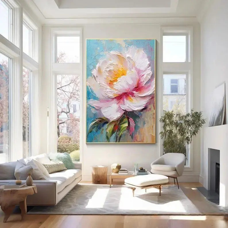 A large vertical painting of a big white plastered flower with great leaves in the middle of a blue canvas 

