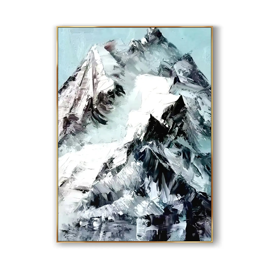 A large vertical plaster wall art featuring a majestic snowy mountain in striking white and black tones, nearly dominating the serene blue sky.
