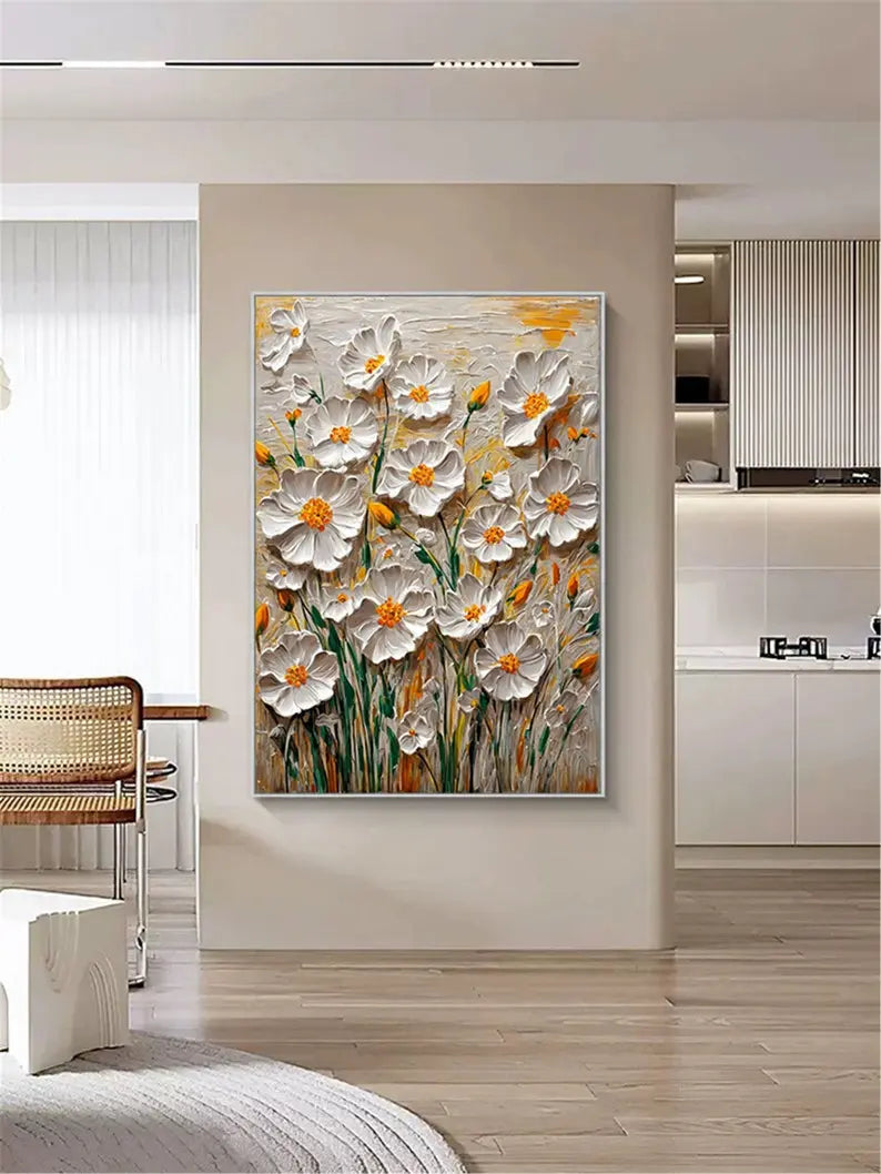 A large vertical textured painting of white flowers in rich acrylics with orange pistils, and green stems against a white and orange backdrop