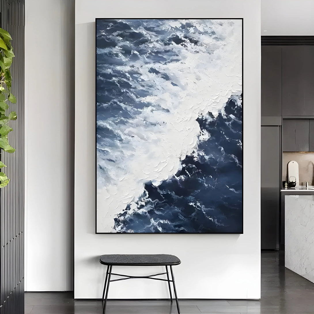 A large vertical textured wall art featuring the rough blue waves exploding into frothy white spray
