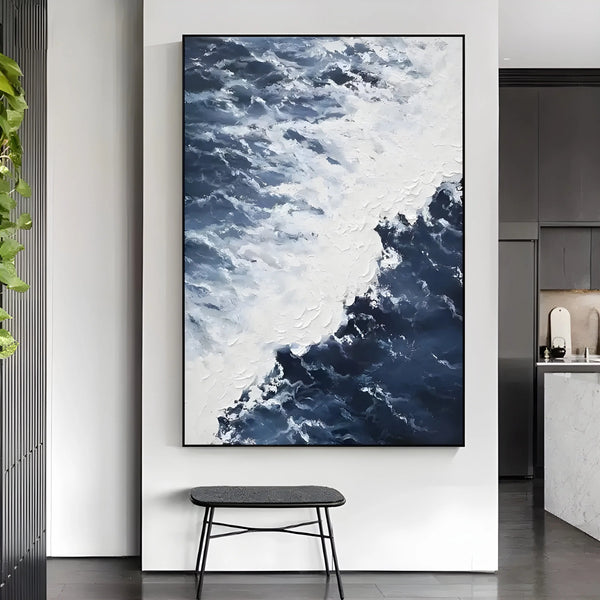 A large vertical textured wall art featuring the rough blue waves exploding into frothy white spray
