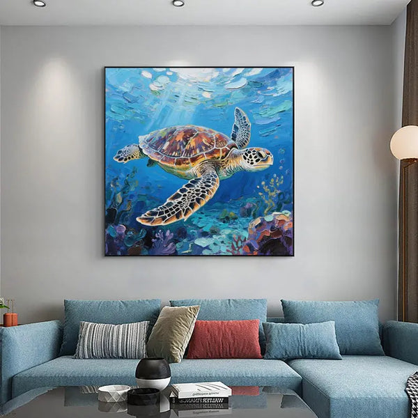 A square painting featuring a large turtle swimming in the transparent blue sea. Below it are seaweeds and corals.
