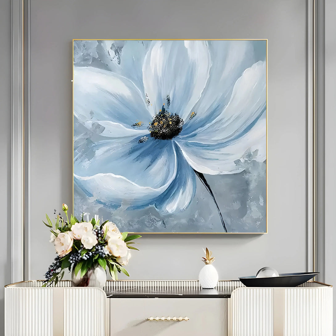  A square textured floral painting of a large blooming blue flower with black pistils and blue petals. 