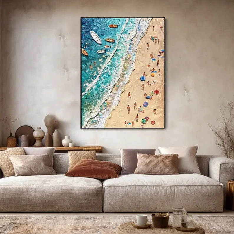 A textured vertical wall art of blue sea waves gently splashing on the beige beach full of holiday makers. Small boats and swimmers float in the sea waves. 
