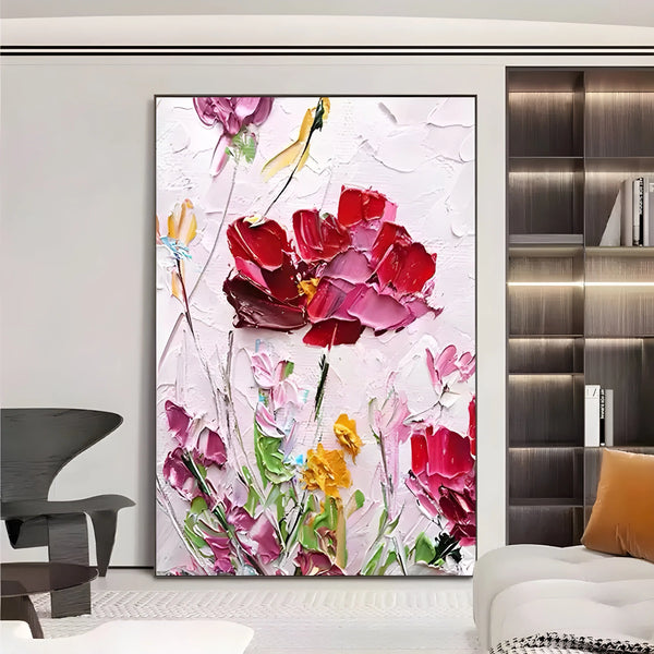A vertical abstract flower painting in pink tones with palette knife textures forming blooming flowers in a scenic landscape.