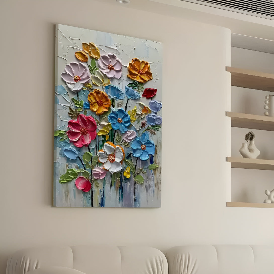 A large vertical painting with lots of flowers in pink, red, white, blue, yellow, etc against the backdrop of white and blue 