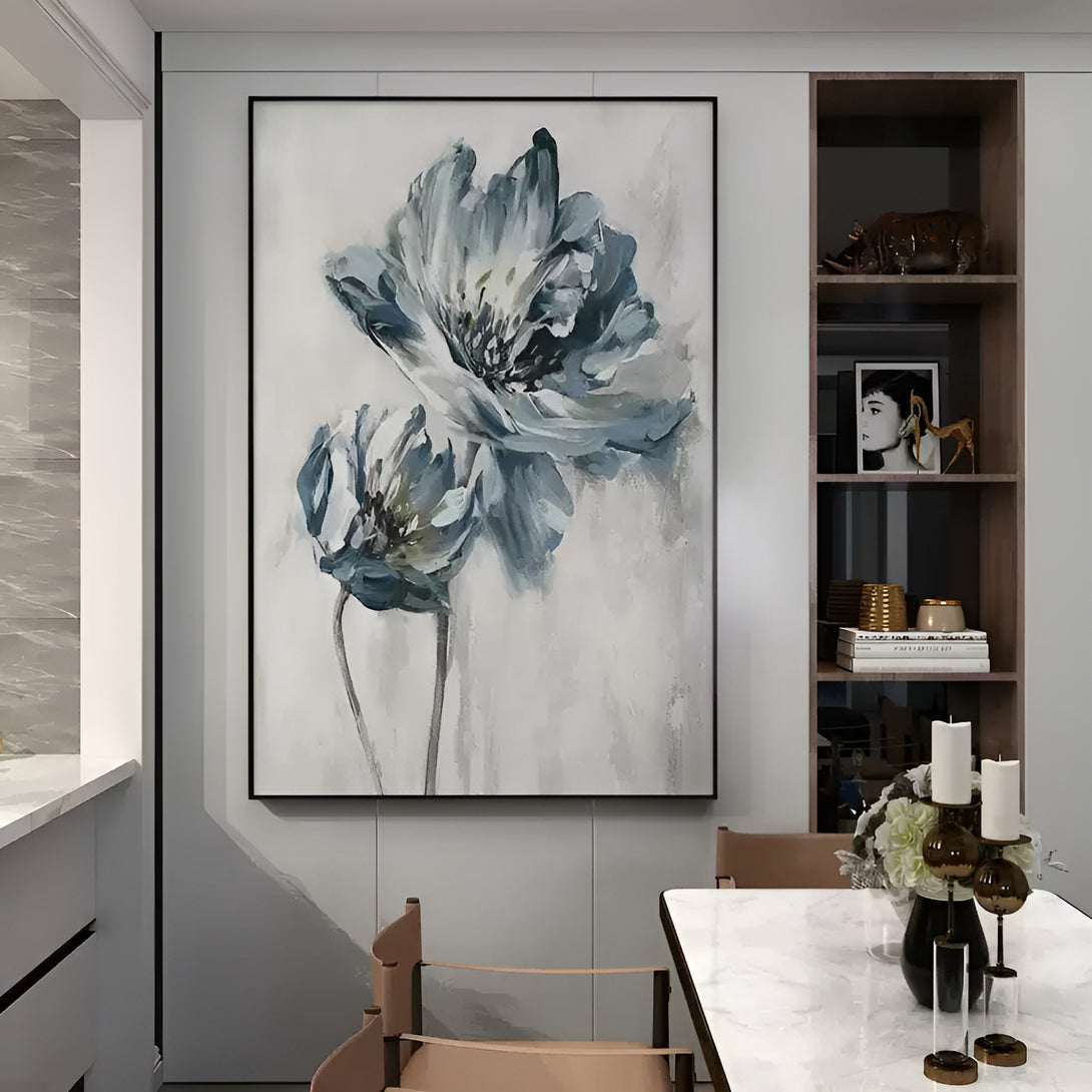 A large vertical abstract painting of 2 blue and white flowers against a grey backdrop