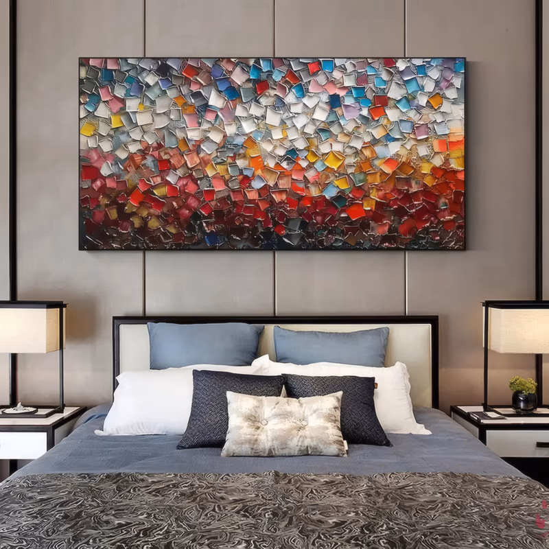 a large panoramic textured painting made of hundreds of small raised paint squares, grading from white, blue and pastel chips along the top down to deep red and crimson at the base, in sculpted relief impasto