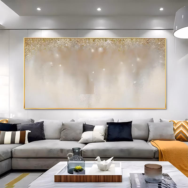 a wide panoramic minimalist painting of a soft cream and beige field with dense gold flecks gathered along the top edge and thinning as they drift toward the lower half, in thick textured paint