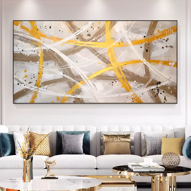 a wide horizontal abstract painting of sweeping gold, taupe and white arcs crossing over a cream ground, flecked with black and gold splatter, in thick brush and palette-knife acrylic