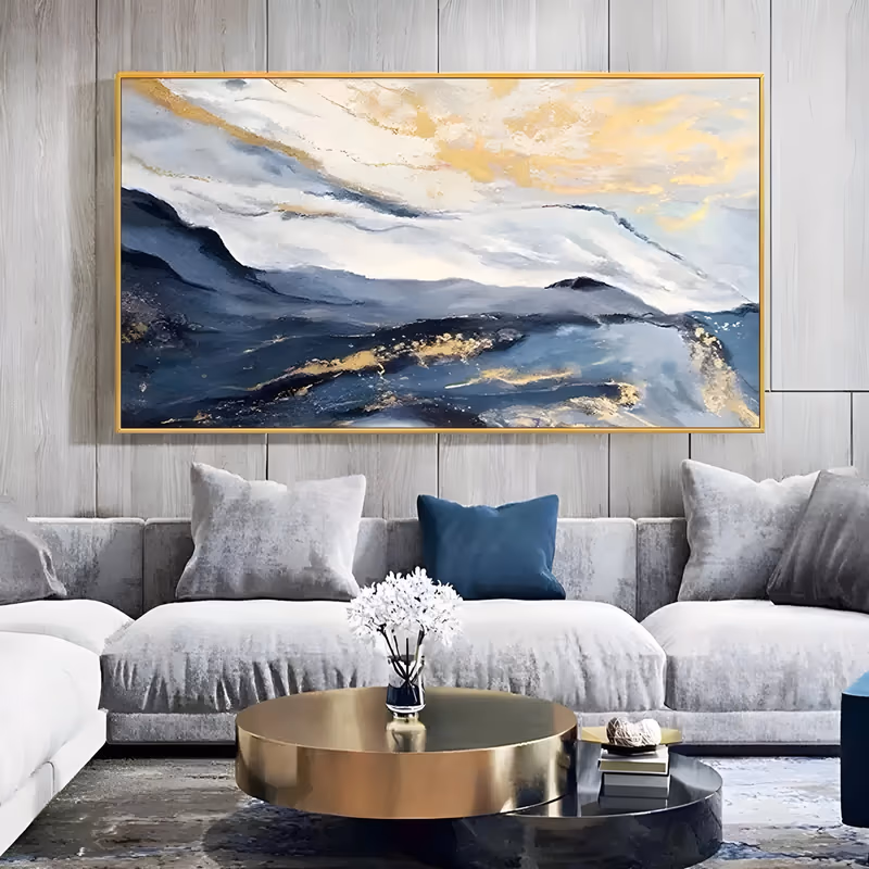 an oversized horizontal abstract painting of layered blue and charcoal mountain ridges along the lower half, under a white sky streaked with warm gold cloud light, in soft brushed oil