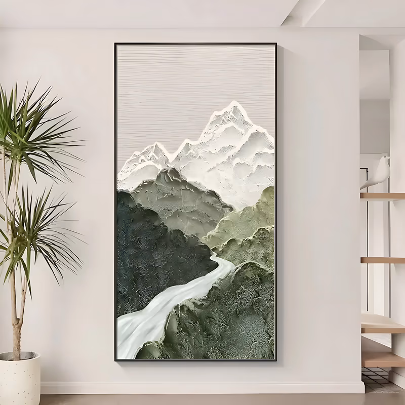 a tall narrow plaster relief painting of a mountain valley, white snow-capped peaks at the top, dark and olive green forested slopes below and a pale river winding down through the center