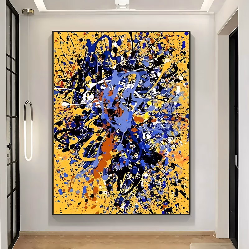 a large vertical abstract painting of cobalt, periwinkle, black and rust drips and flung splatter scattered over a warm mustard yellow ground, dense at the center and thinning toward the edges, in poured acrylic