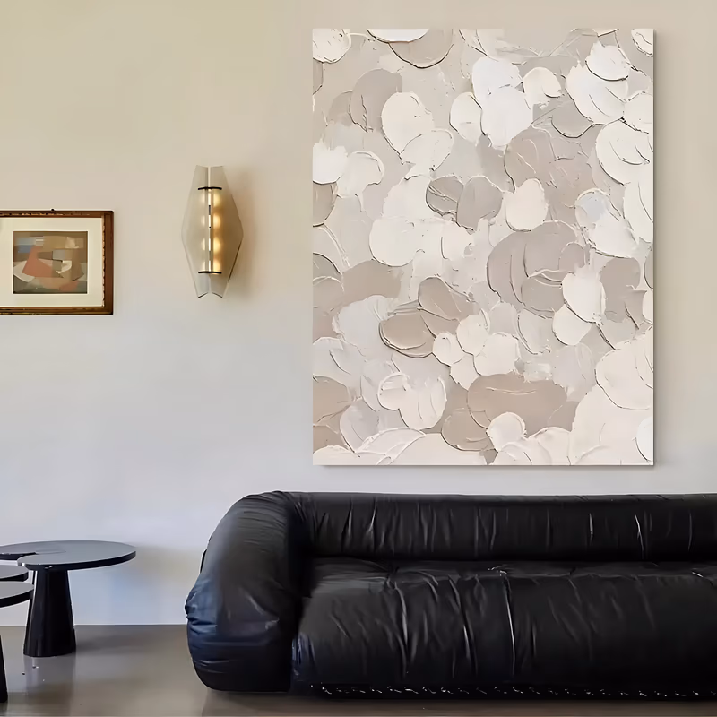 a large vertical textured canvas covered in overlapping petal-shaped dabs of thick cream, white, beige and taupe paint, each stroke laid flat with a knife so the ridges stand proud of the surface