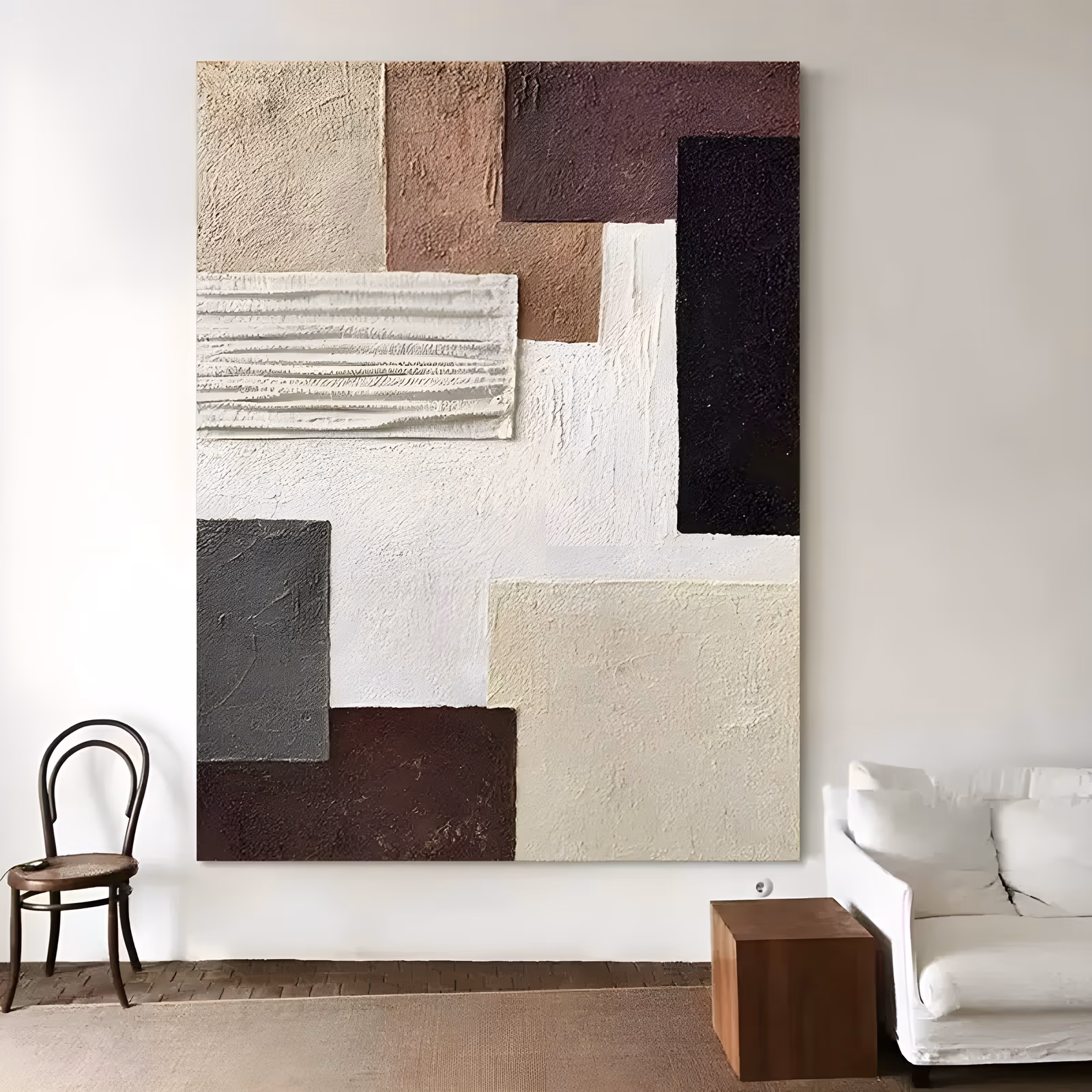 a large vertical textured canvas built from overlapping rectangles of troweled plaster in beige, terracotta, plum brown, black, charcoal and white, with one ribbed pale sage slab raised over the left side