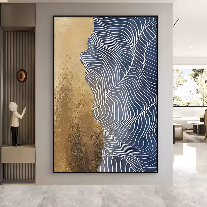 a large vertical textured painting divided down the middle, a rough gold field on the left and deep navy on the right covered with fine raised white contour lines that ripple like sand ridges, in relief