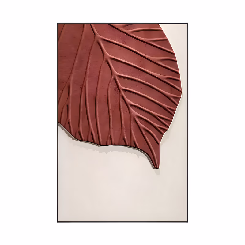 a large vertical relief painting of one oversized burgundy leaf set in the upper left corner, its veins carved in raised ridges, casting a soft shadow on a plain cream ground, in sculpted plaster