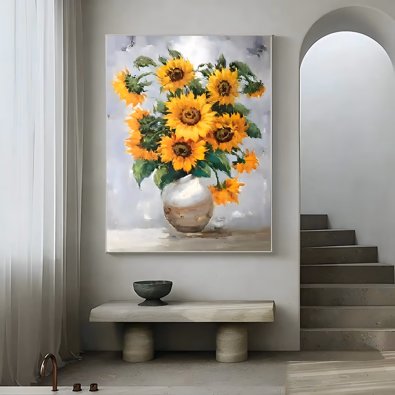 a large vertical impressionist painting of golden yellow sunflowers with broad green leaves standing in a round white ceramic vase, set against a soft gray and white background, in loose brushed oil